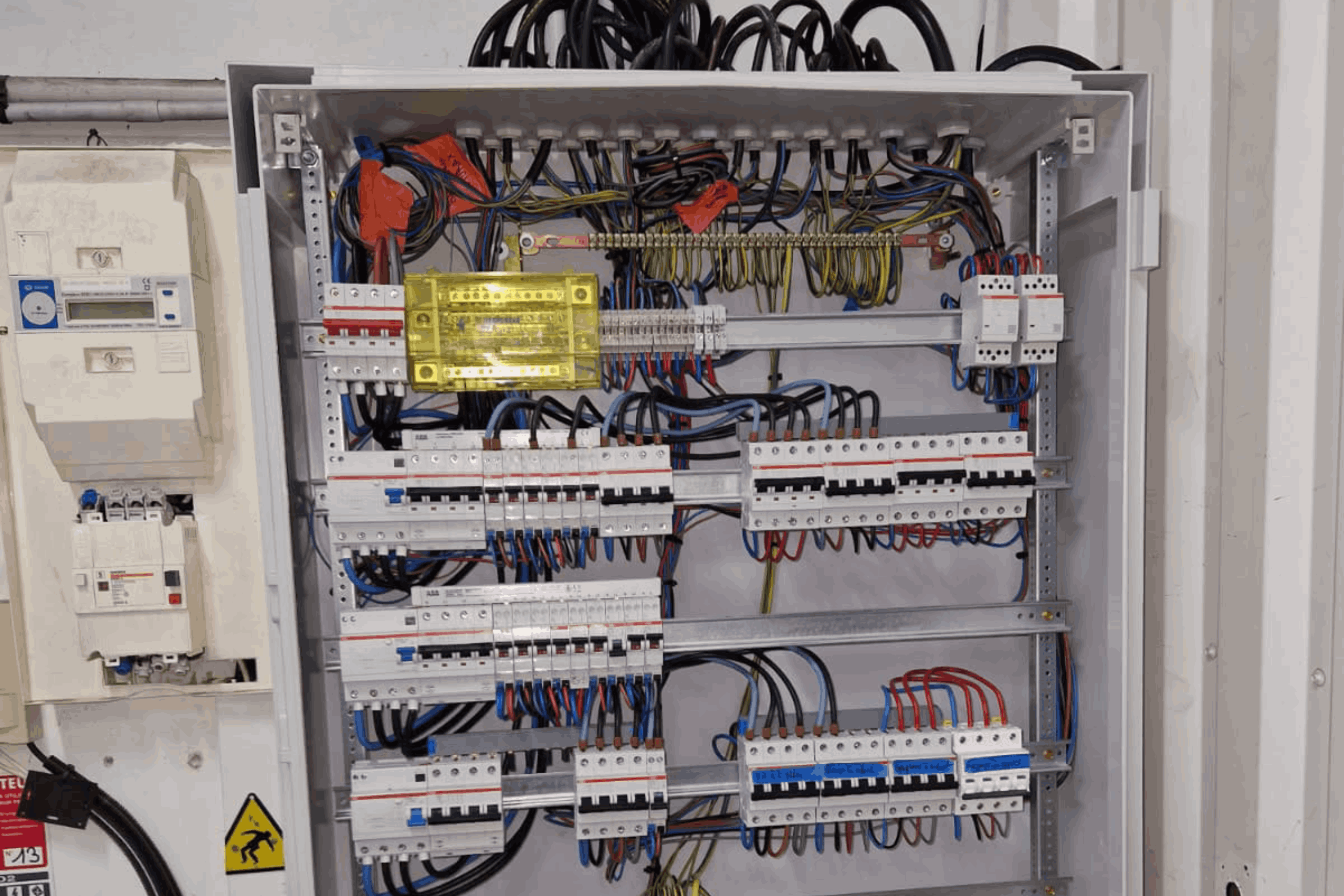 electrician-construction-worker-overalls-with-drill-installation-sockets-home-renovation-concept-scaled